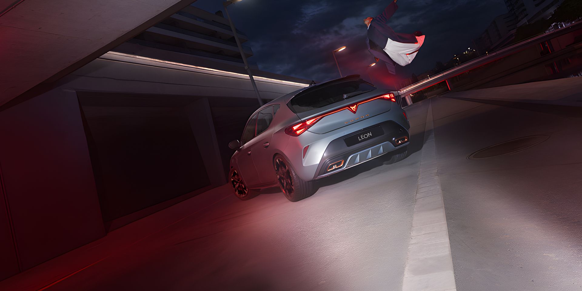 a guy flying above CUPRA Leon