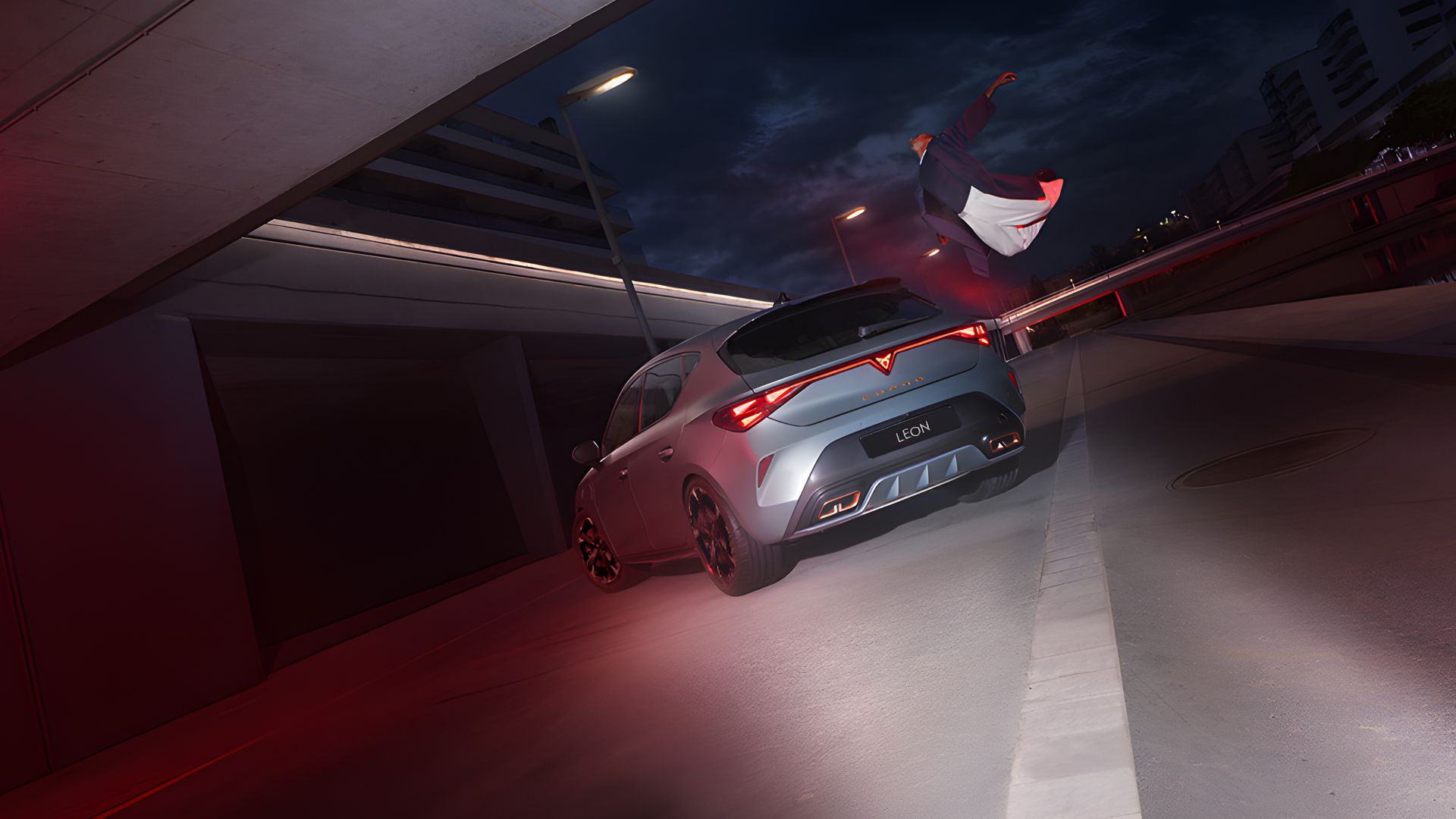 a guy flying above CUPRA Leon