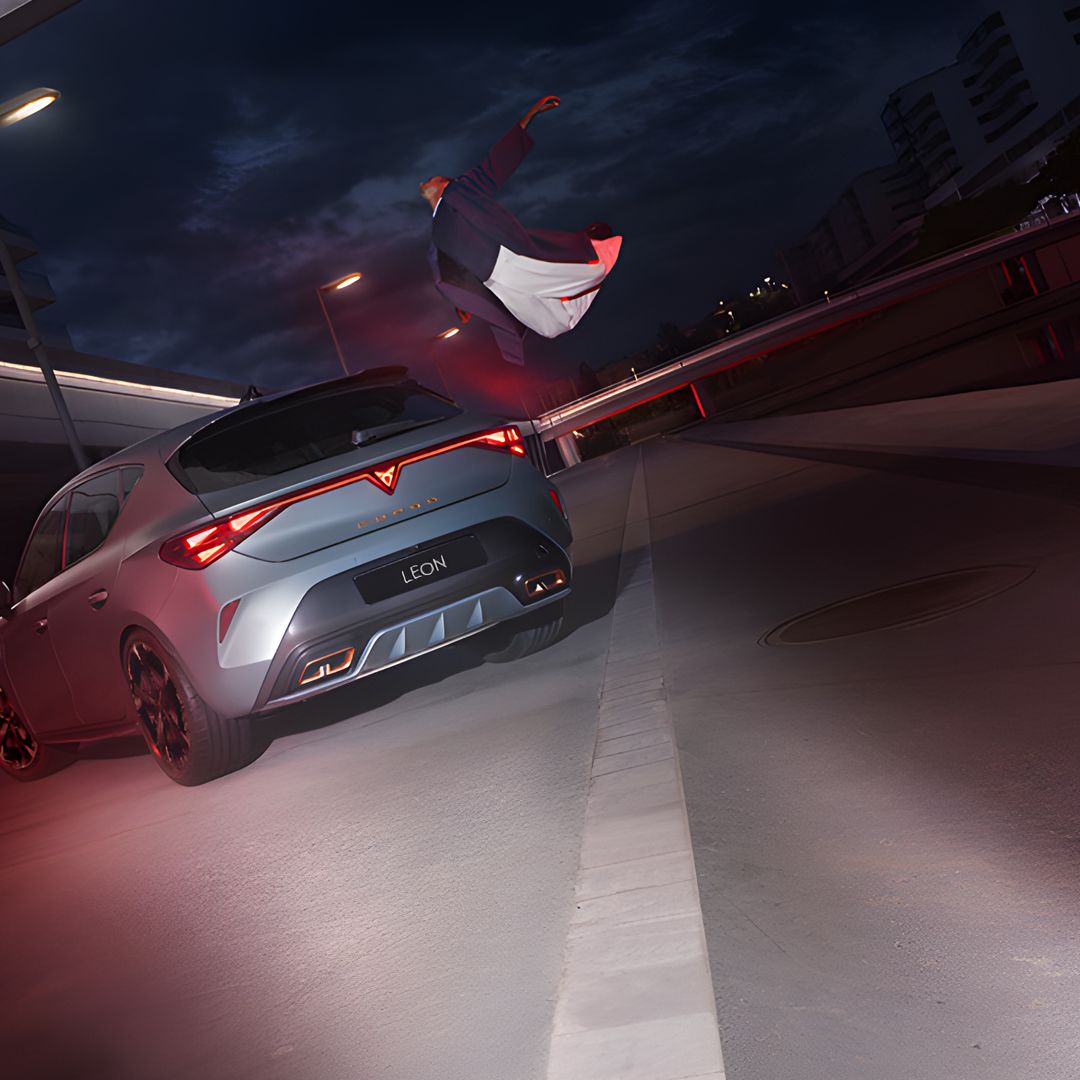 a guy flying above CUPRA Leon