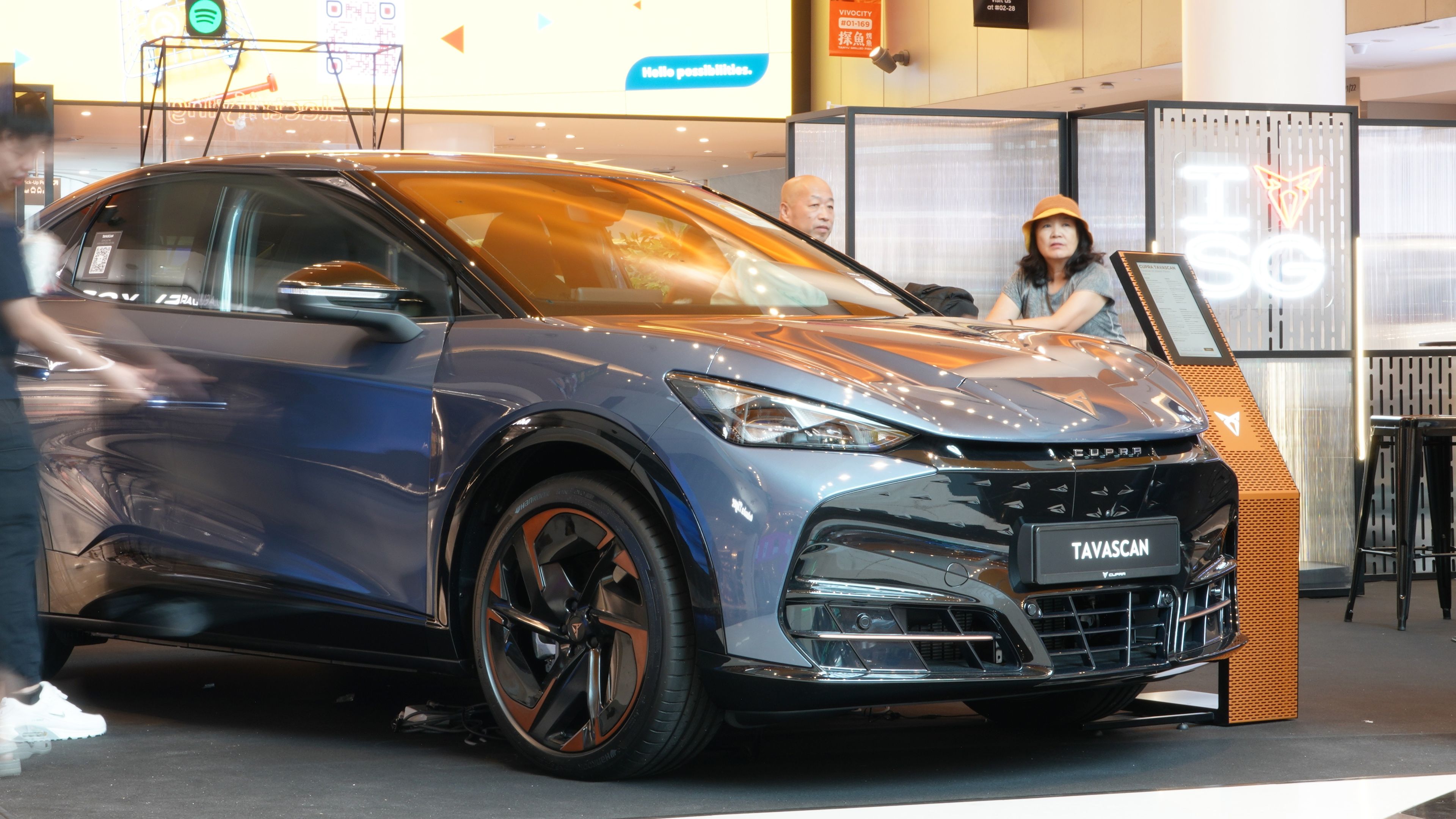 customer viewing CUPRA Tavascan during roadshow