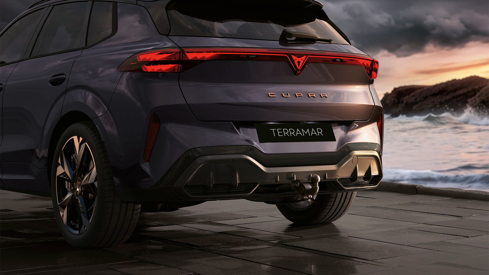 CUPRA Terramar rear view by the side of the ocean. 