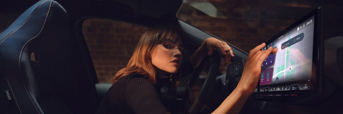 A lady using the infotainment screen in CUPRA Born