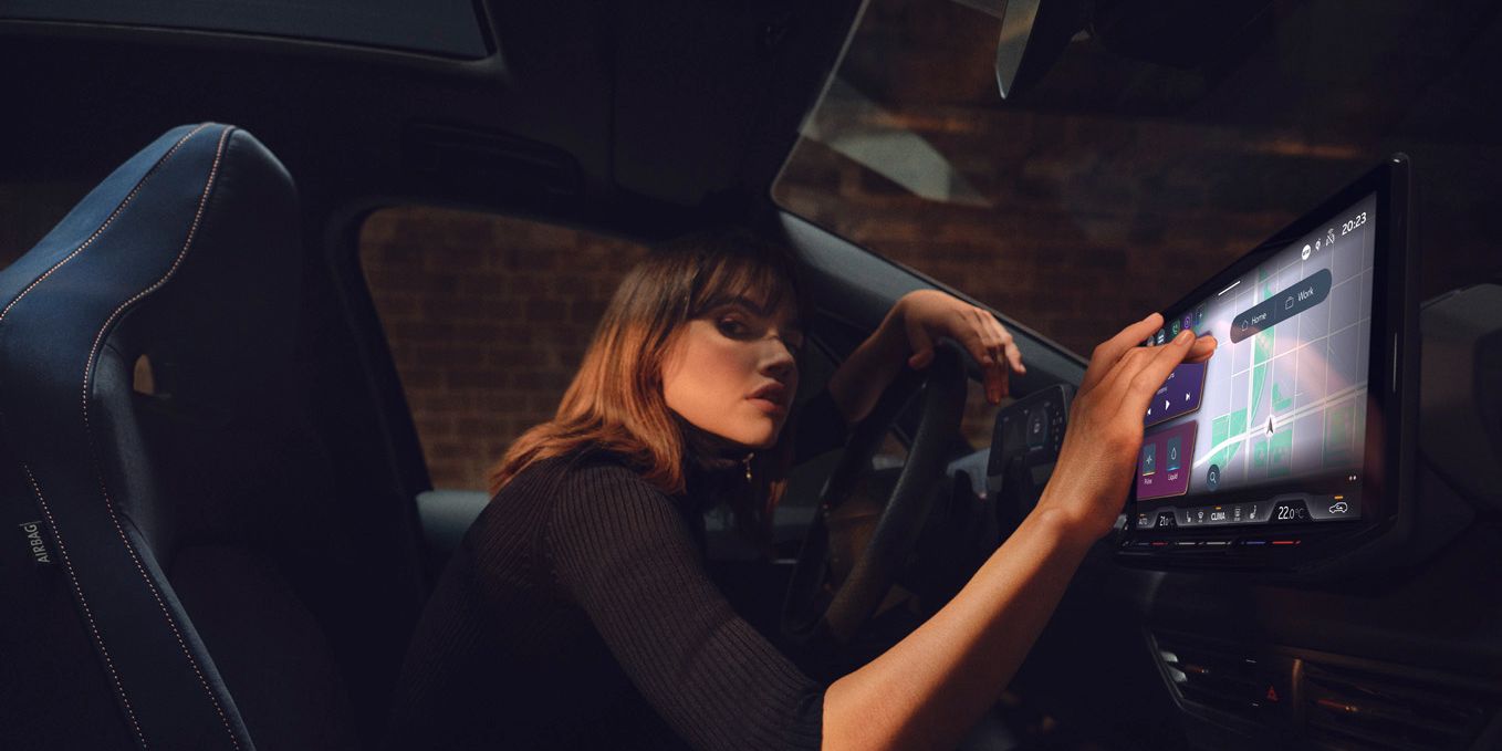 A lady using the infotainment screen in CUPRA Born