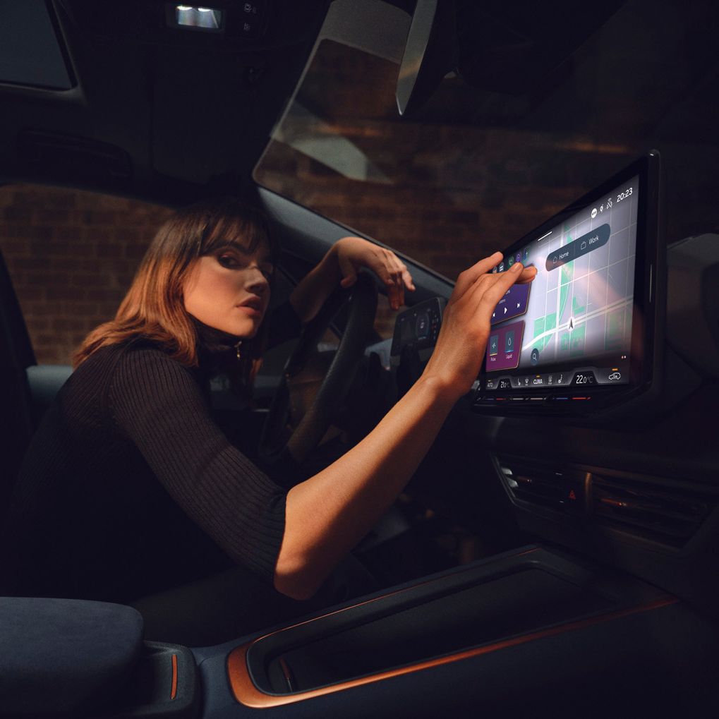 A lady using the infotainment screen in CUPRA Born