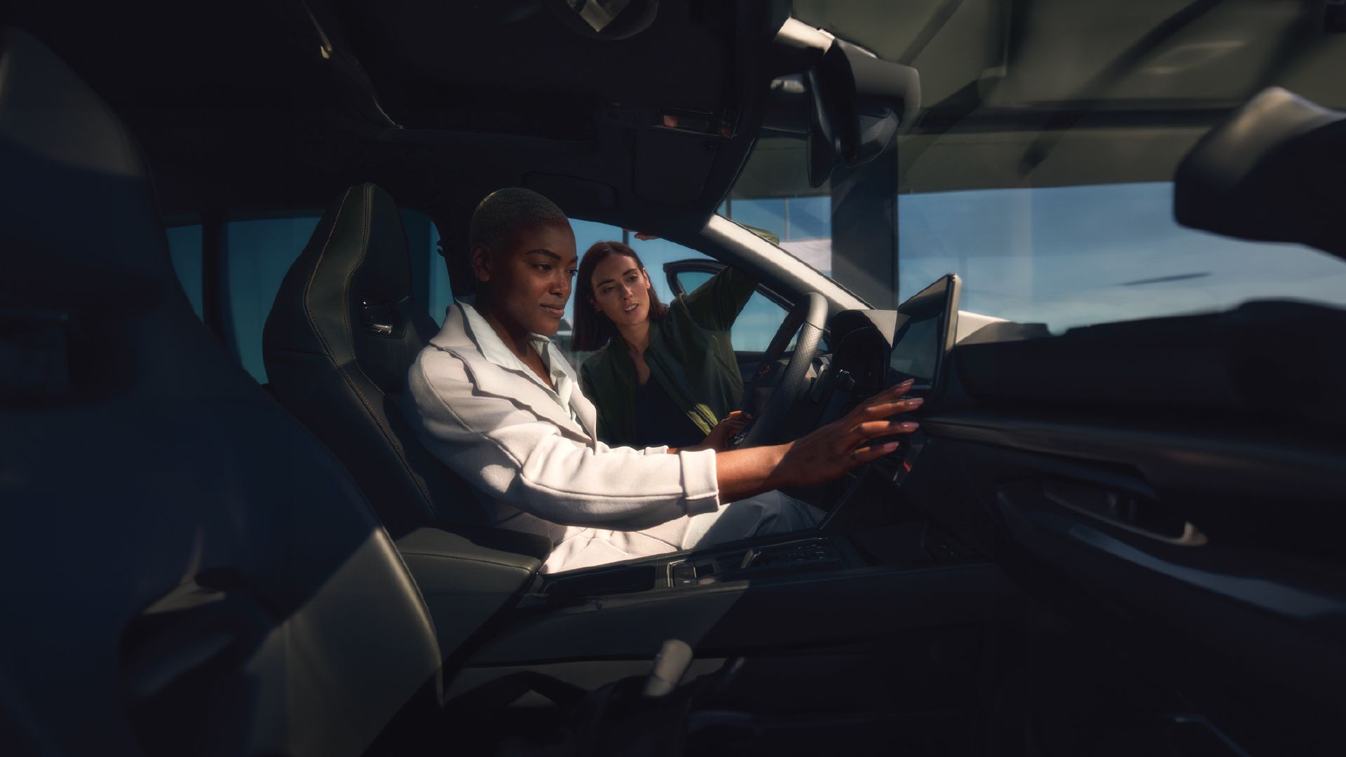 A customer testing out CUPRA car and checking out the infointament system