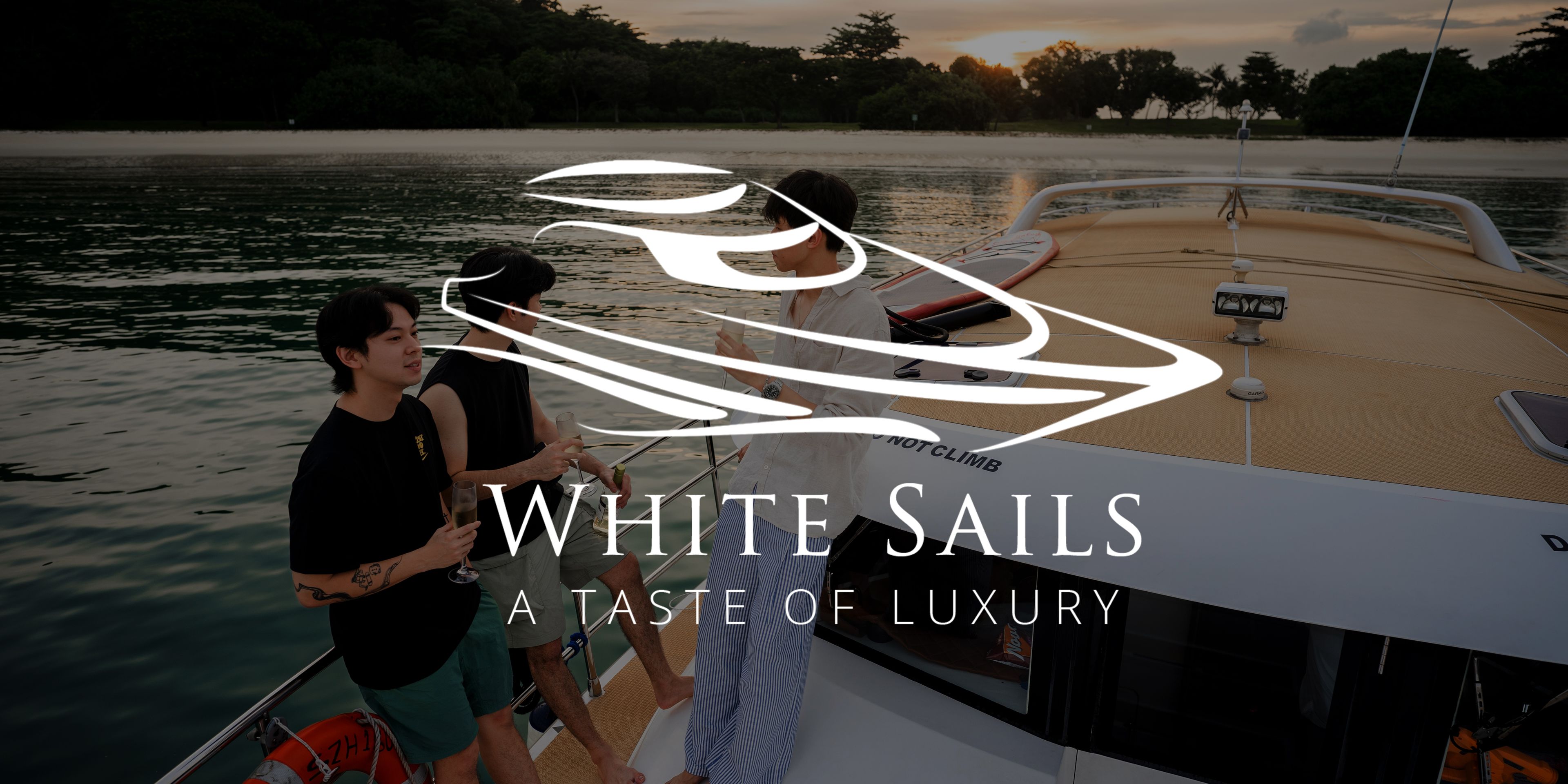 White sails logo with a background of people enjoying their time on a yatch