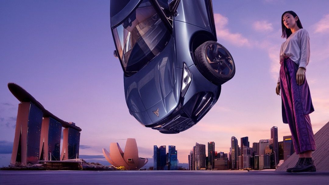 CUPRA Tavascan hanging by the Singapore CIty view with a Singaporean lady standing beside