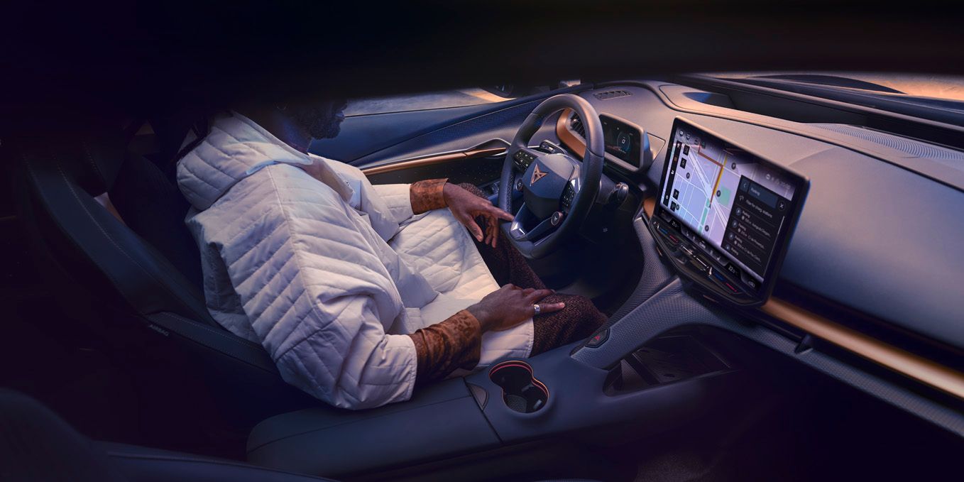 A guy sitting in CUPRA Tavascan driver seat