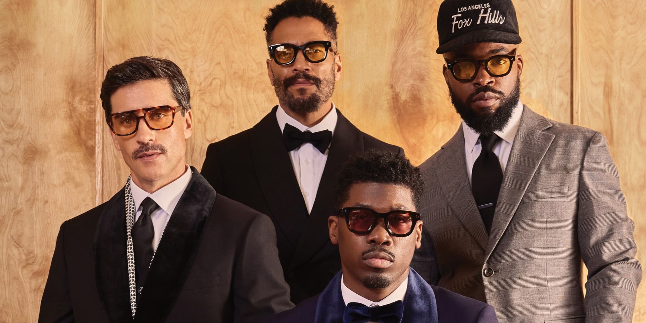 close up of four men in suits from benjamin Barker