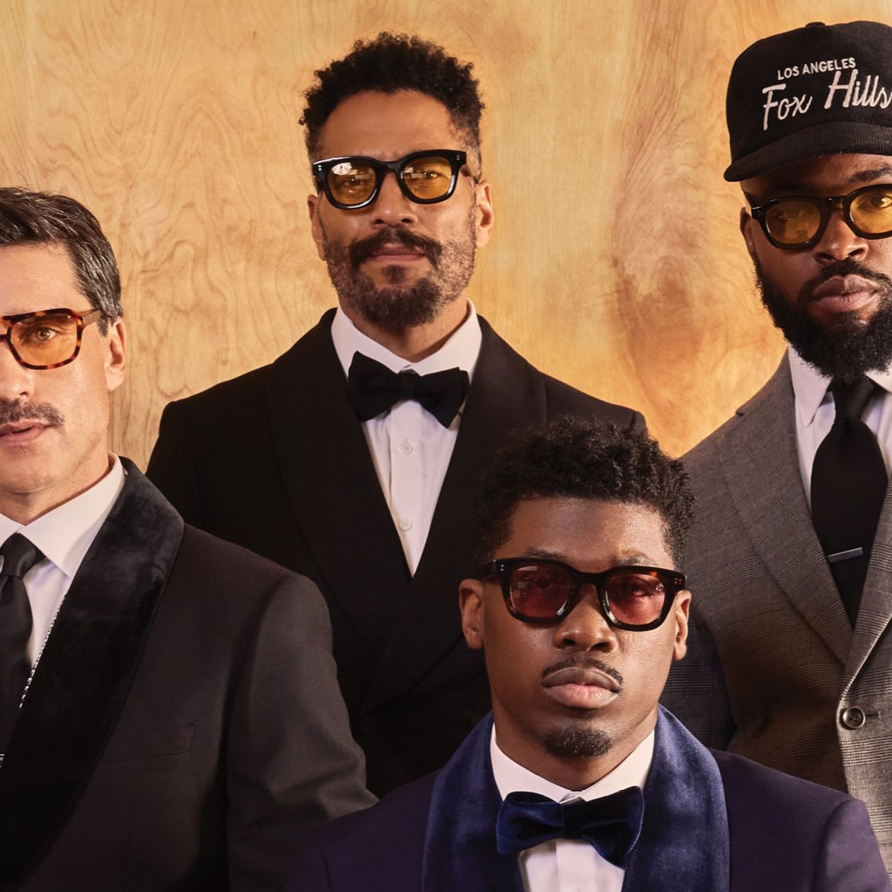 close up of four men in suits from benjamin Barker