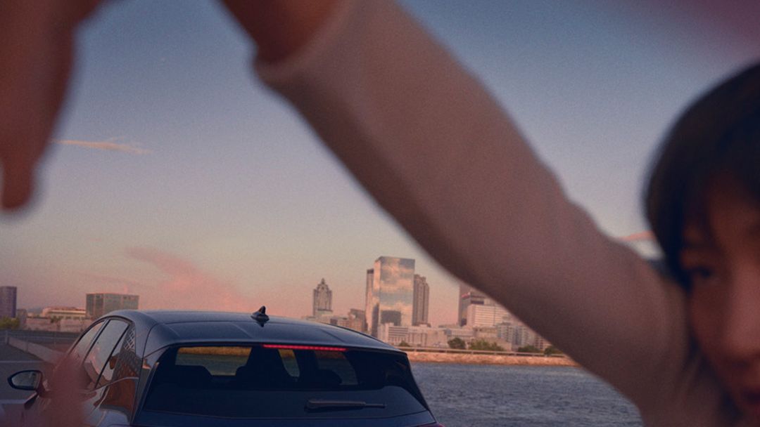 looking through CUPRA Born from the person arms