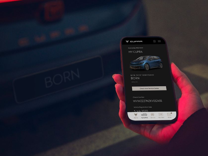 A mobile showing CUPRA SG App with a CUPRA Born in the background