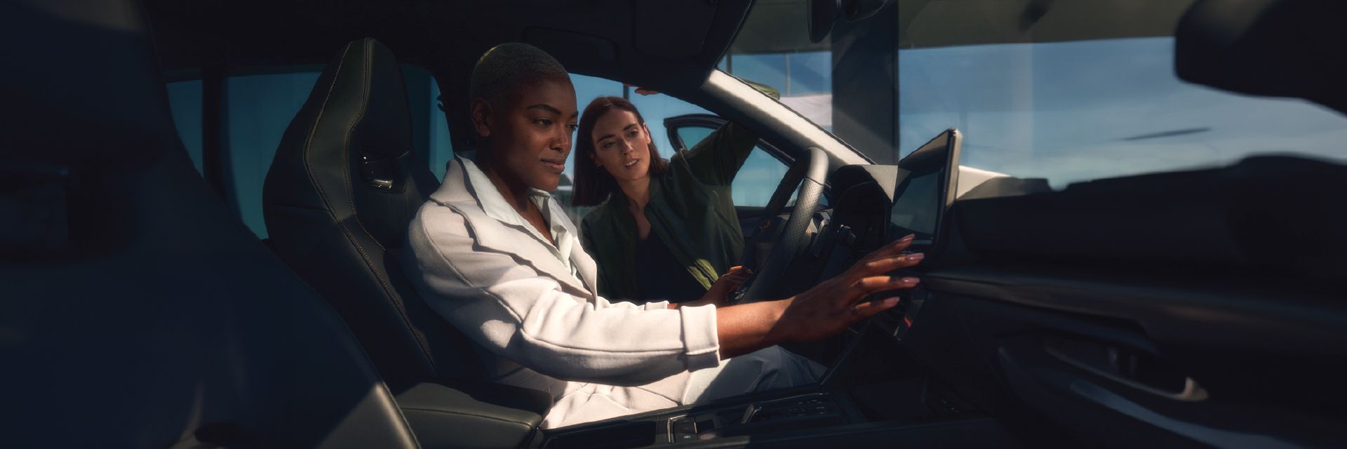 A customer testing out CUPRA car and checking out the infointament system