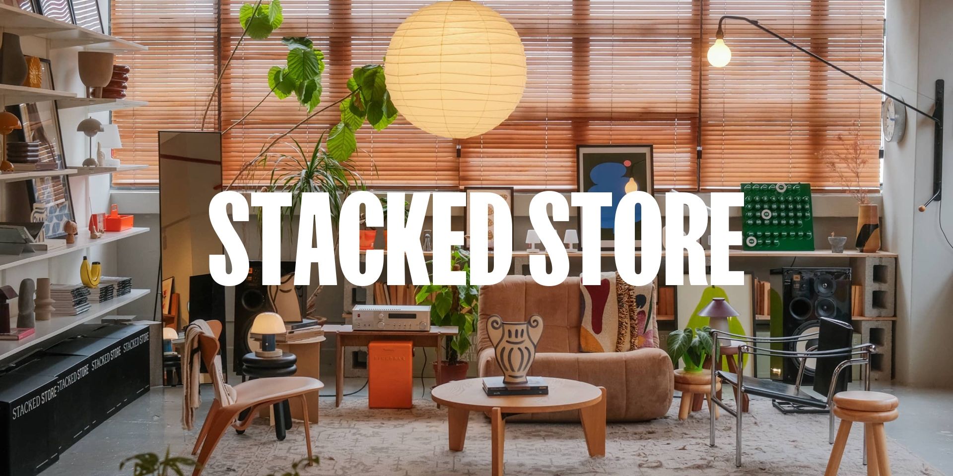 stacked store logo with a background of neatly place furnitures
