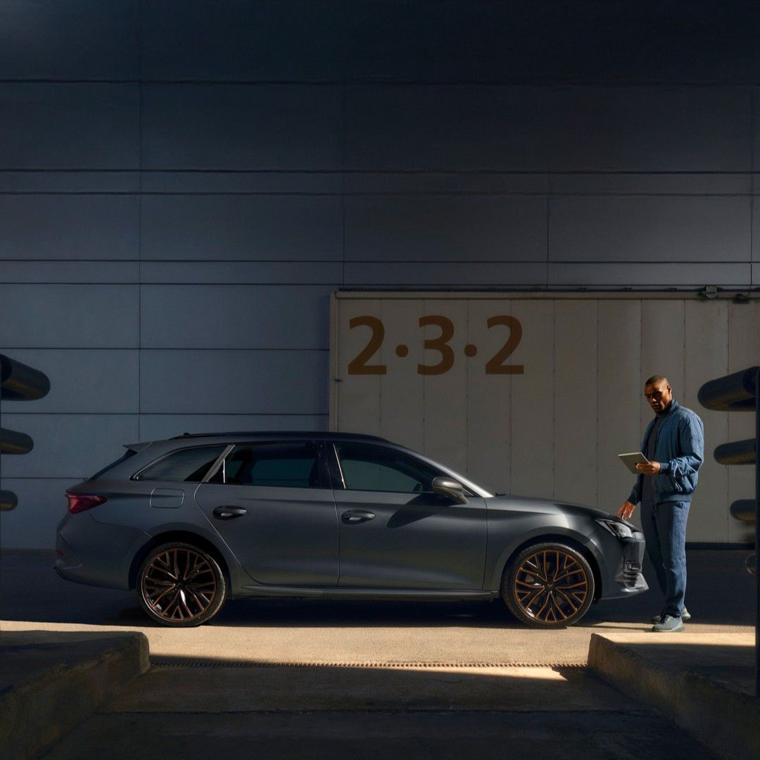 A guy checking on the CUPRA Leon condition