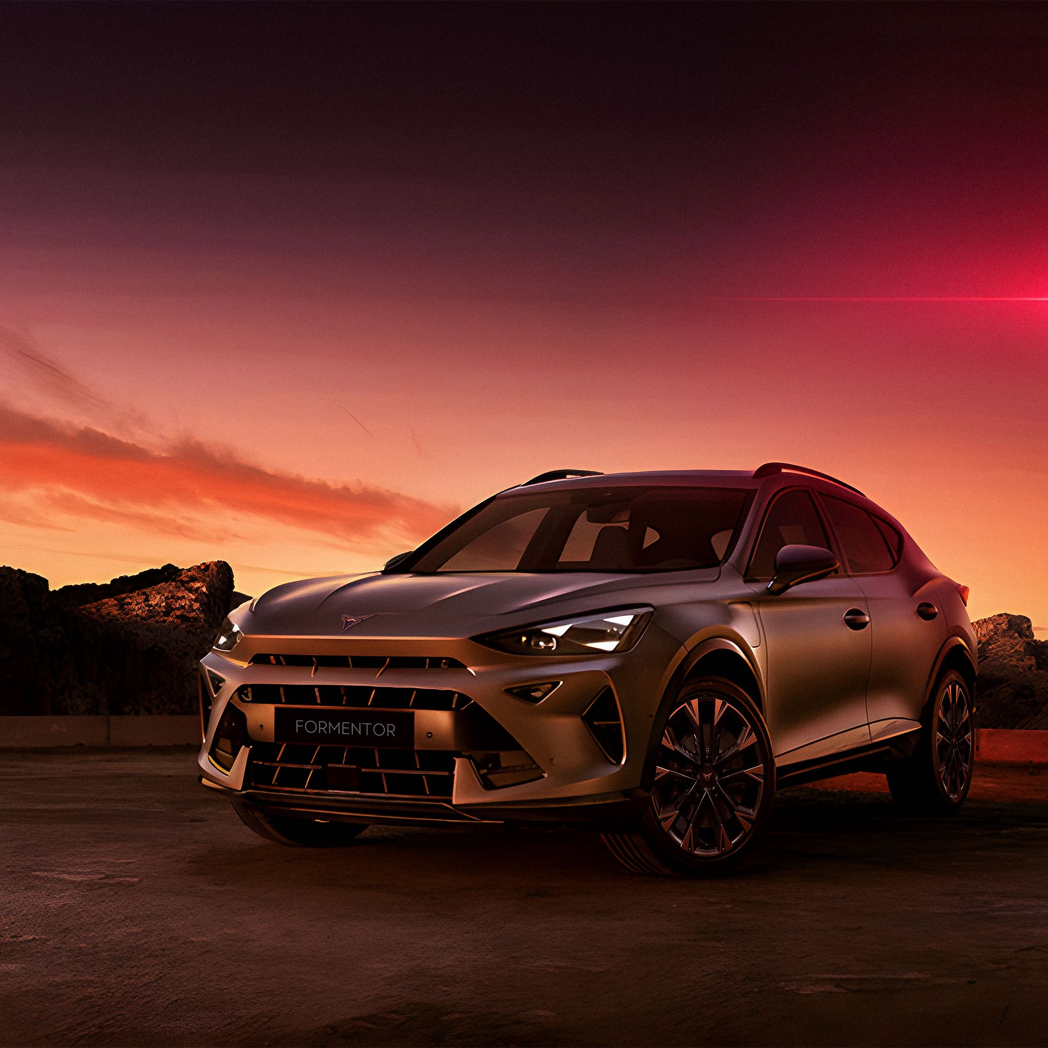 CUPRA Formentor with Graphene Grey and 19 inch Arctic Copper alloy rims with a red beam in the sky