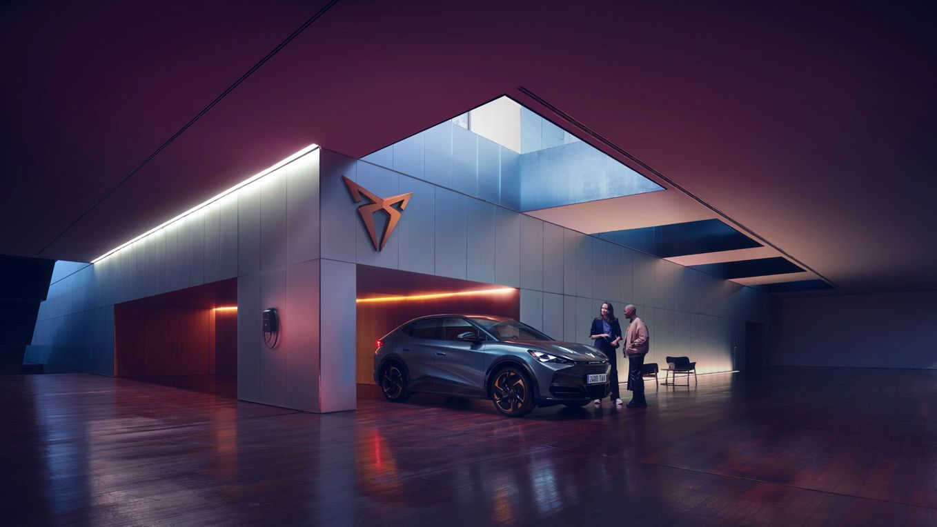 CUPRA sales associate showing CUPRA Tavascan to customer