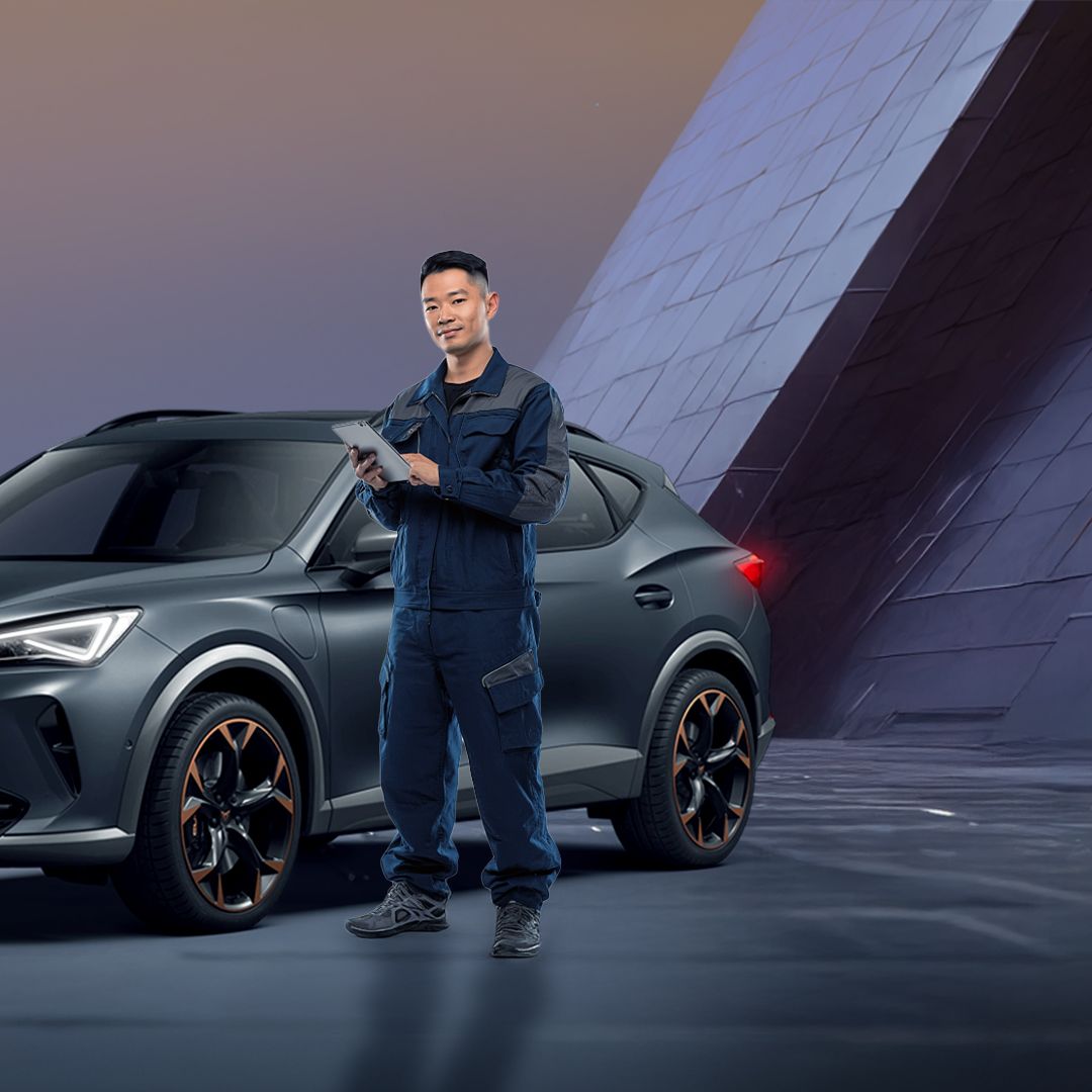A CUPRA servicing crew standing infront of a CUPRA Formentor