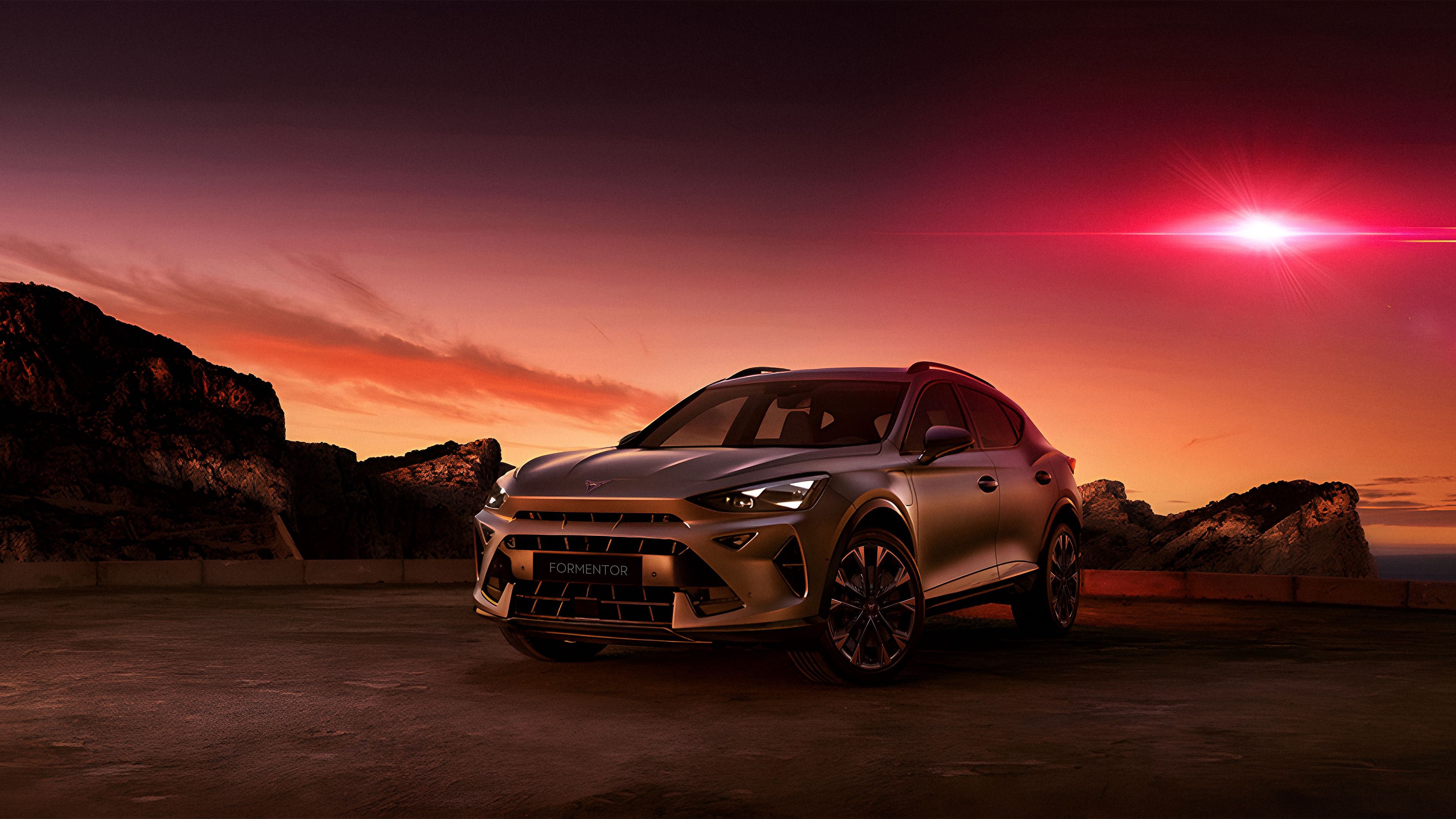 CUPRA Formentor with Graphene Grey and 19 inch Arctic Copper alloy rims with a red beam in the sky